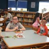 Librarian Tracy Gunn oversees a room full of smiles at William Perry Elementary