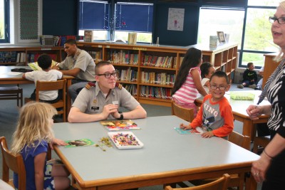 Librarian Tracy Gunn oversees a room full of smiles at William Perry Elementary