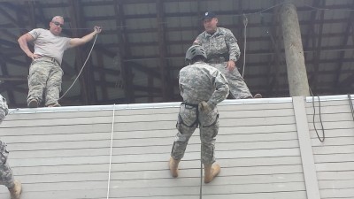 MSG William Morton fills role of rappel-master as Cadet Goshgarian descends tower.