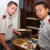 Fishburne Military School Cadets Jacob Fincham (Fredericksburg, VA) and Matthew Sim (Henrico, VA) show off box of glasses already collected for needy.