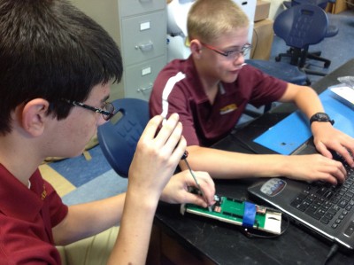 Rocket Club Cadets Preparing Equipment for a Data Download