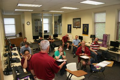 Fishburne Military School Headmaster briefs Summer Session faculty during Thursday's In-Service and luncheon