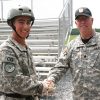 Fishburne SAI, LTC Robert Hunt, congratulates Cadet Alex Ralston who earned command of B Co. during JROTC 4th Brigade's JCLC Eagle