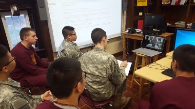 Fishburne's Cyber-patriot Team skype with JMU Cyber Defense Club during a training session last season